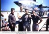 Jim Walsh, Doug Yockey, Roy Davenport and Don Rossi. Background F-105 Thunderchief